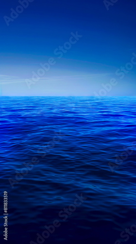 A blue ocean with a dark sky.
