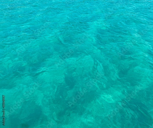 Background picture of sea water. Clear sea water with small waves. It is a warm  fun atmosphere  very suitable for swimming.