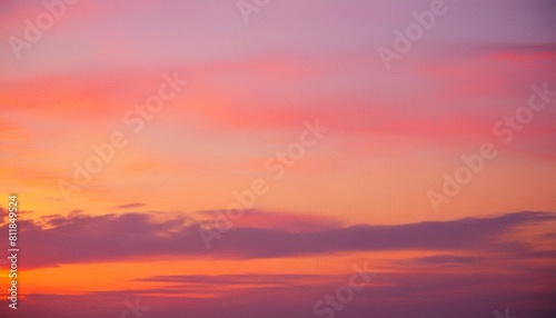 abstract colorful background in hot pink and orange sunset colors with mottled blurred texture abstract painted sky or sunrise