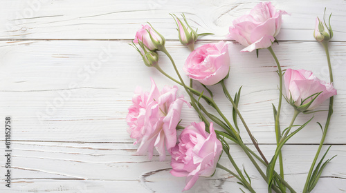 Beautiful pink eustoma flowers on white wooden background © Jafger