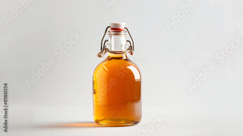 Bottle of apple cider vinegar on white background