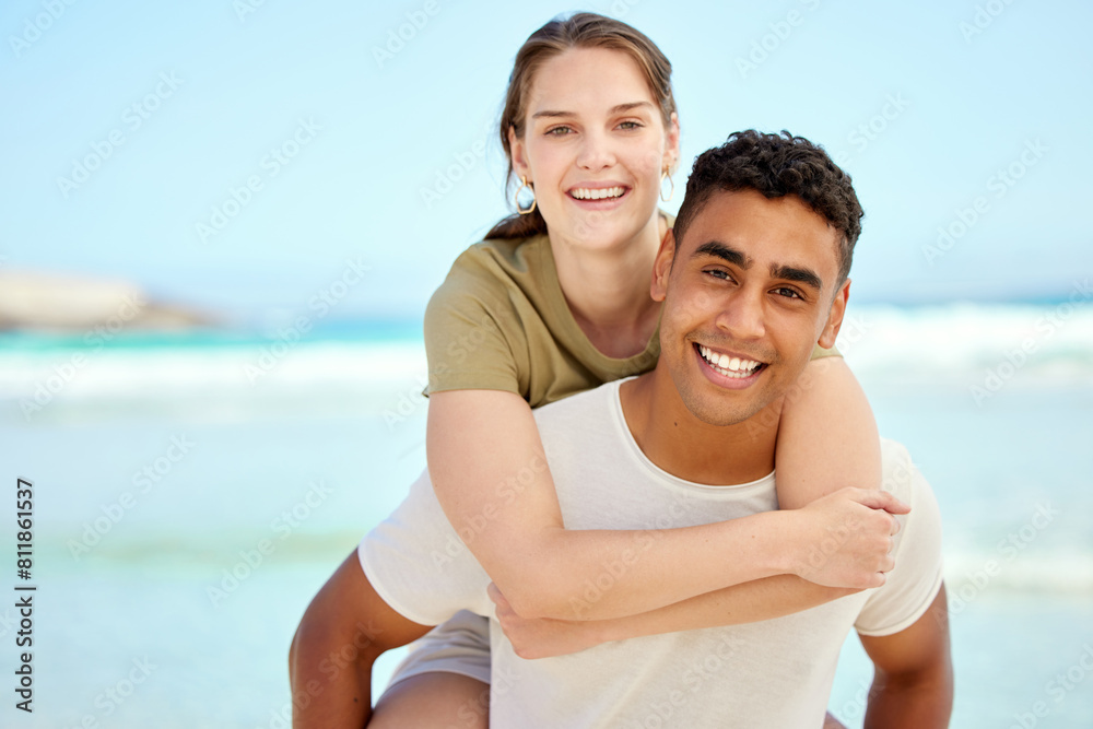 Portrait, piggyback and happy couple at beach on vacation, holiday or travel in summer together. Face, interracial man and woman at sea for adventure date, laugh and hug by ocean outdoor for support Portrait, piggyback and happy couple at beach on vacation, holiday or travel in summer together. Face, interracial man and woman at sea for adventure date, laugh and hug by ocean outdoor for support