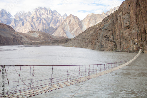 Hussaini Suspension Bridge Over Hunza River In Gojal Valley Of Hunza, Pakistan. Hussaini Suspension Bridge Is Pakistan's Most Dangerous Rope Bridge. photo