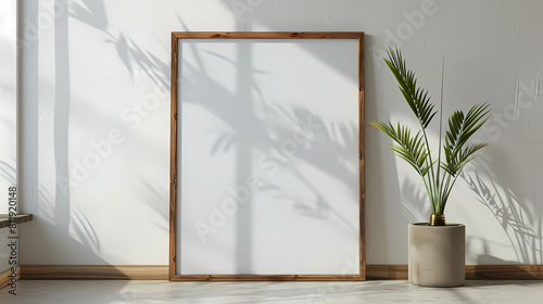 Minimal wooden picture poster frame mockup on white wallpaper © TP SHOTS