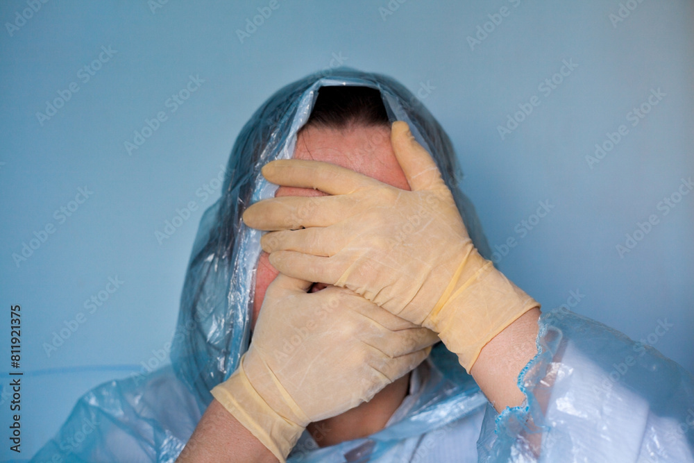 Woman in a protective suit closing her face.