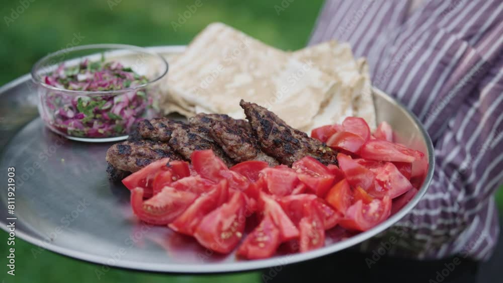 grilled lamb kebab meat serving on a steel plate grilled lamb kebab meat serving on a steel plate