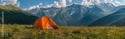 Summer vacation in the mountains. Photo of tent  on the top of a mountain at sunset. 