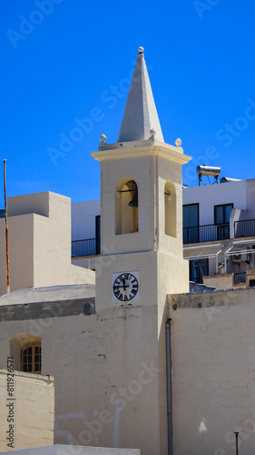 The bell and clock tower of St Paul's Church, Marsalforn, Gozo