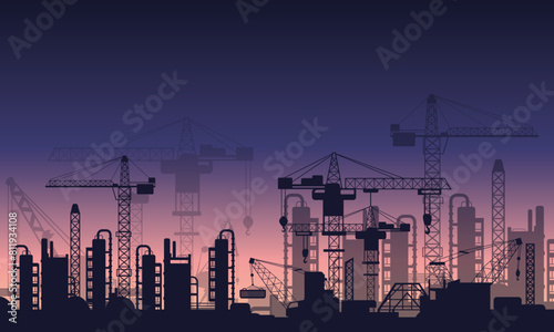 Sunset view and tower crane silhouette on construction site