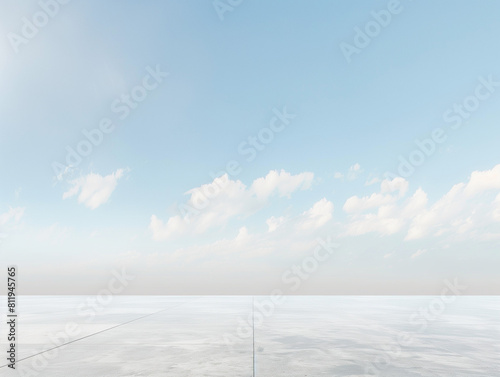 Expansive view of a vast white plane under a blue sky dotted with fluffy clouds, evoking a sense of infinite space and calm.