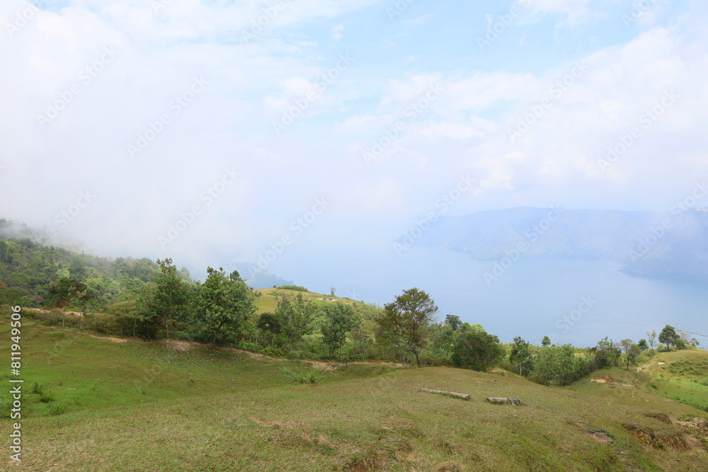 Stunning scenery of volcanic lake Toba - largest and deepest crater lake in the world located in North Sumatra, Indonesia Stunning scenery of volcanic lake Toba - largest and deepest crater lake in the world located in North Sumatra, Indonesia