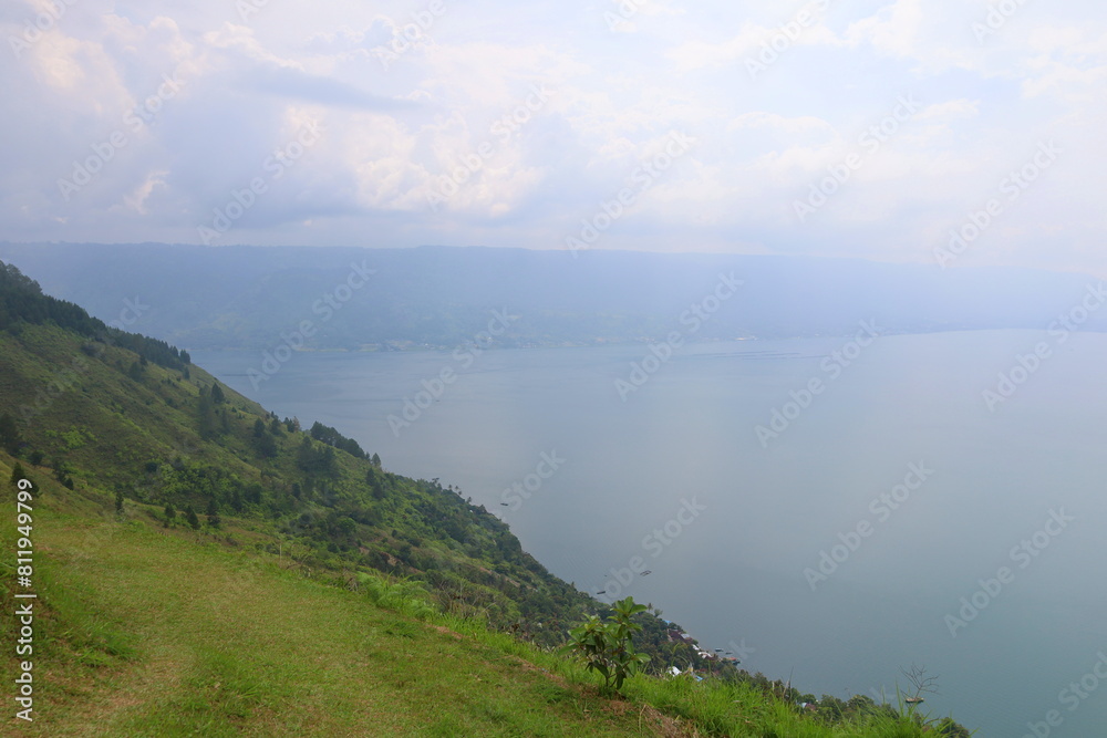 Stunning scenery of volcanic lake Toba - largest and deepest crater lake in the world located in North Sumatra, Indonesia Stunning scenery of volcanic lake Toba - largest and deepest crater lake in the world located in North Sumatra, Indonesia