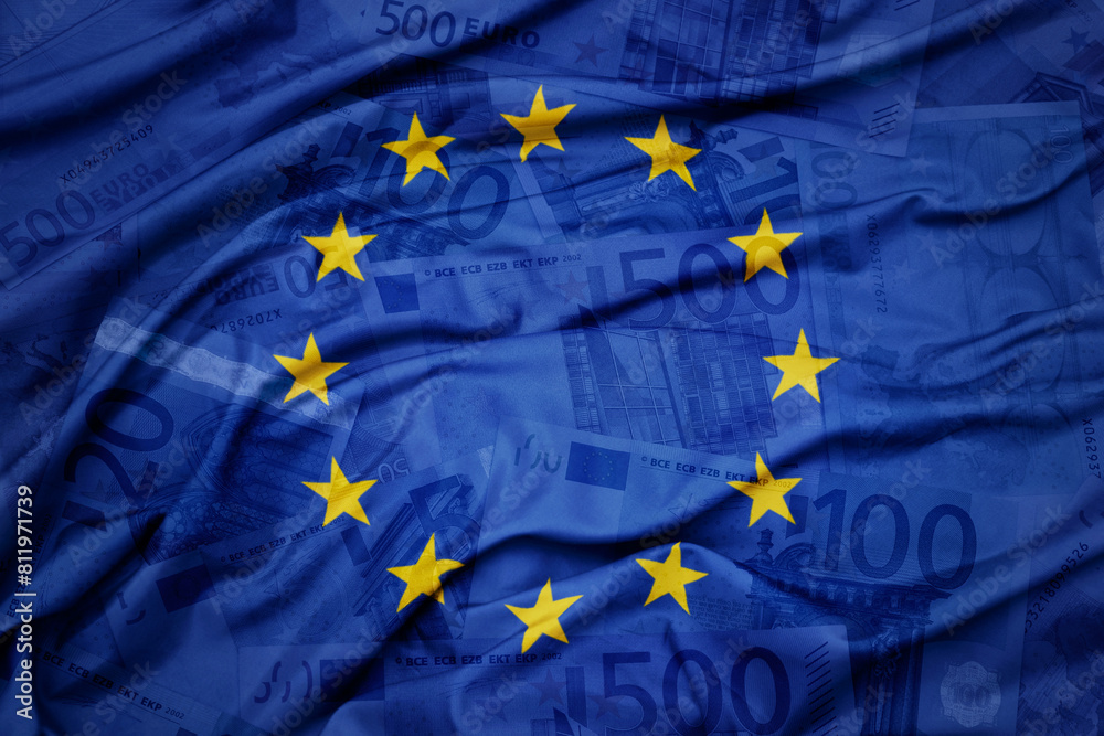 waving colorful national flag of european union on a euro money banknotes background. finance concept. waving colorful national flag of european union on a euro money banknotes background. finance concept.