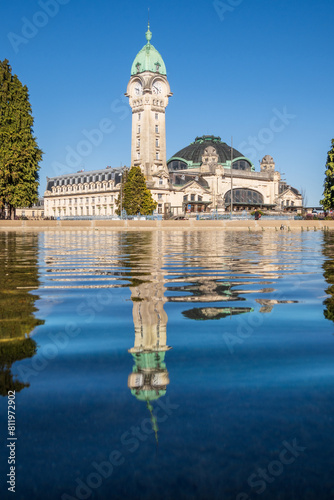 View of the train station in Limoges reflecting in blue water, vertical photography, France