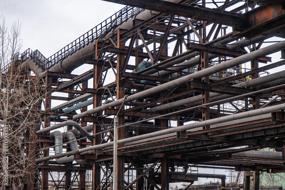 Abandoned industrial equipment. Steel pipelines, cables and piping. Abandoned industrial equipment. Steel pipelines, cables and piping.