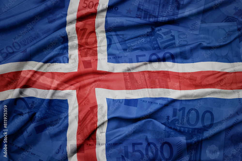 Fototapeta premium waving colorful national flag of iceland on a euro money banknotes background. finance concept.