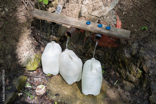 underground source of clean fresh water, filled canisters for a home supply of essential products, high quality photo