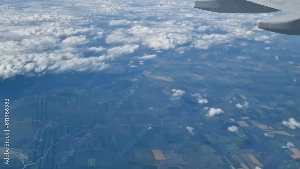 The view from the window of an air plane to the clouds, blue sunny sky. The view from the window of an air plane to the clouds, blue sunny sky.