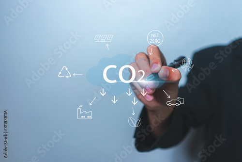 Reducing CO2 emissions and combat global warming and climate change. Businessman planning new ideas and technology for eco-friendly solutions for a sustainable future.