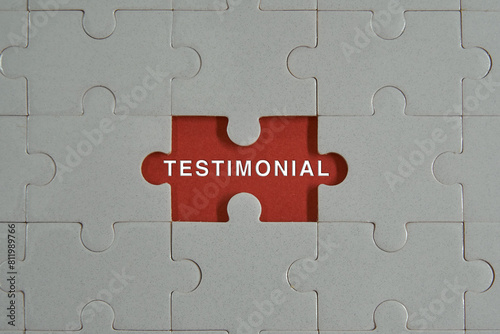 Piece of jigsaw puzzle with words TESTIMONIAL.