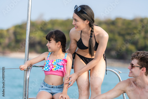 Caucasian family enjoy spending a quality wellbeing vacation holiday trip on a sailboat or yacht together, Concept of bonding recreation or activity, ocean or seascape traveling or journey, happiness.