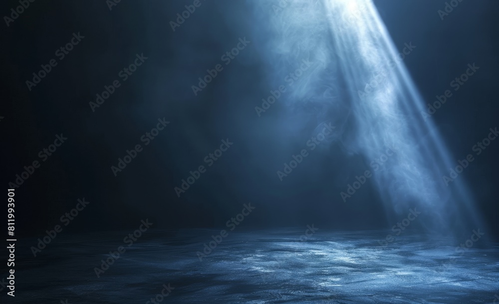 Black background with one spotlight beam shining down on the center of it Black background with one spotlight beam shining down on the center of it