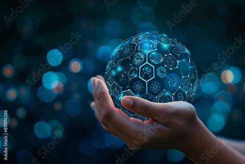 A hand holding a sphere with icons on it