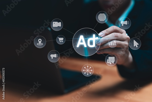 Online marketing and advertising concept. Businessman using laptop planning strategy for future business promotion on websites and social media for traffic and awareness.