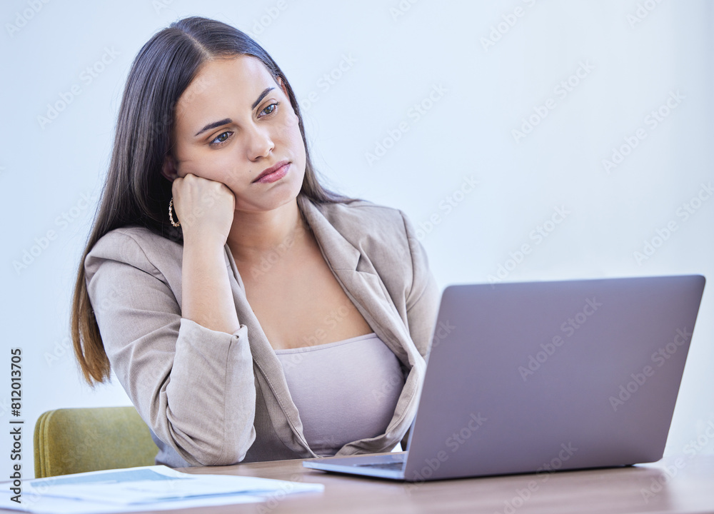 Bored, woman and thinking in office, laptop and daydreaming in business, online and tired of working. Copywriter, computer and moody in workplace, agency and lazy for ideas of blog and project Bored, woman and thinking in office, laptop and daydreaming in business, online and tired of working. Copywriter, computer and moody in workplace, agency and lazy for ideas of blog and project