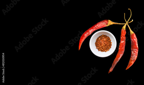 Chili  peppers   in bowl on a back  background.
