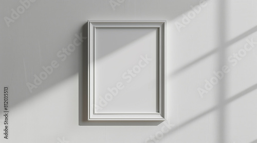 Modern Silver Frame on a White Wall with Natural Light and Shadow Play