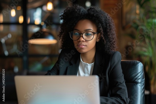 Business Serious. Black Woman in Office Reviewing Project with Laptop, Idea and Focus