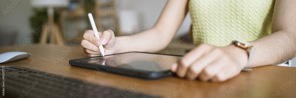 Obraz premium Graphic designer working on digital tablet. artist drawing on graphic tablet and Color swatch samples. Artist Creative Designer sketch graphic drawing creative creativity draw studying work on tablet
