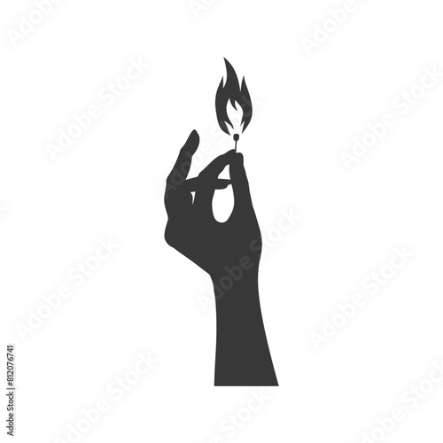 Silhouette hand holding burning match black color only