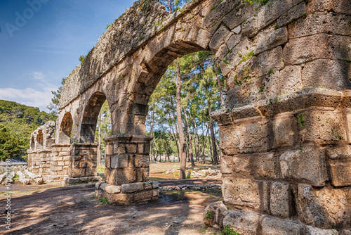 Ancient Roman Aqueduct in Phaselis Archaeological Site Surrounded by Pine Forests, Antalya, Turkey.