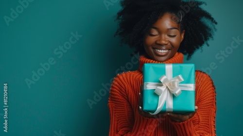 Woman Holding a Gift Box photo