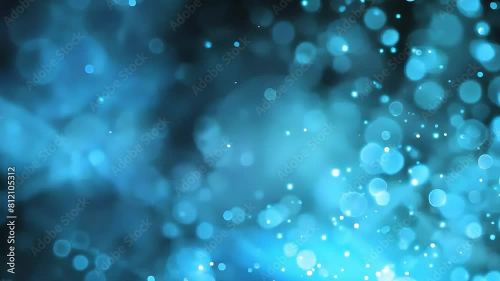 A blue bokeh effect is created by the lights of a projector. A blue bokeh effect is created by the lights of a projector.