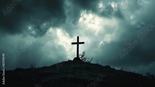 dramatic cross silhouette on hilltop against stormy sky religious concept photography