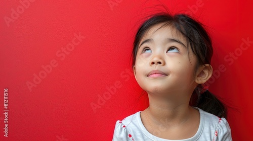 A Japanese girl's gaze is distant yet focused, her mind clearly preoccupied with thoughts and ideas