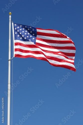 american flag waving in the blue sky. United Stated independence day, USA. Statue of Liberty. 4th of July