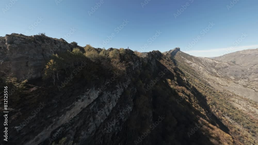 FPV drone flying over the top of the mountain FPV drone flying over the top of the mountain