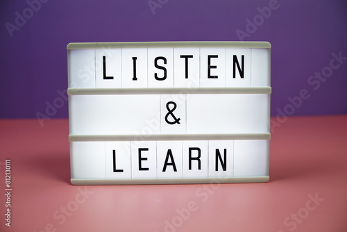 Listen & Learn letterboard text on LED Lightbox on pink and purple background