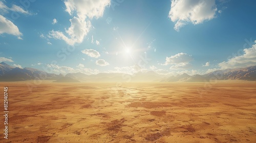 The image shows a vast desert landscape with a clear blue sky and fluffy white clouds photo
