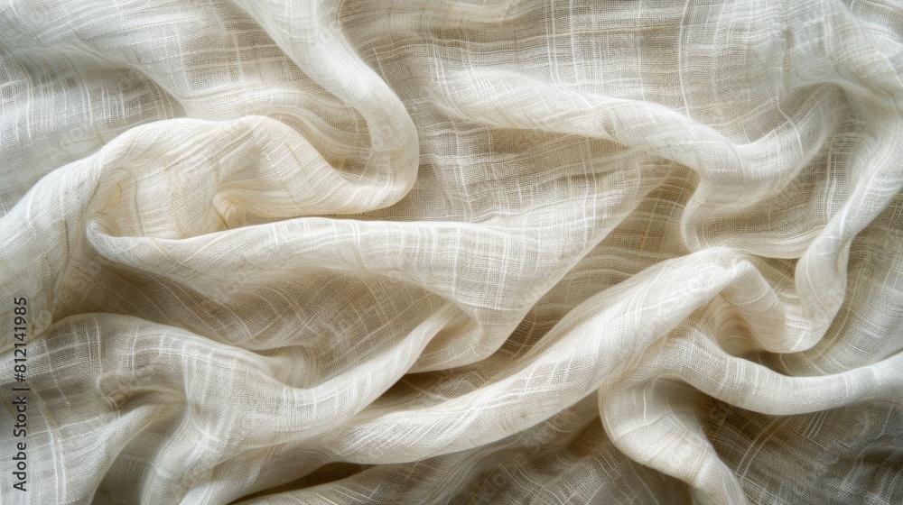 The photo shows a close-up of a wrinkled beige linen fabric. The fabric is soft and looks like it would be comfortable to wear. The photo shows a close-up of a wrinkled beige linen fabric. The fabric is soft and looks like it would be comfortable to wear.