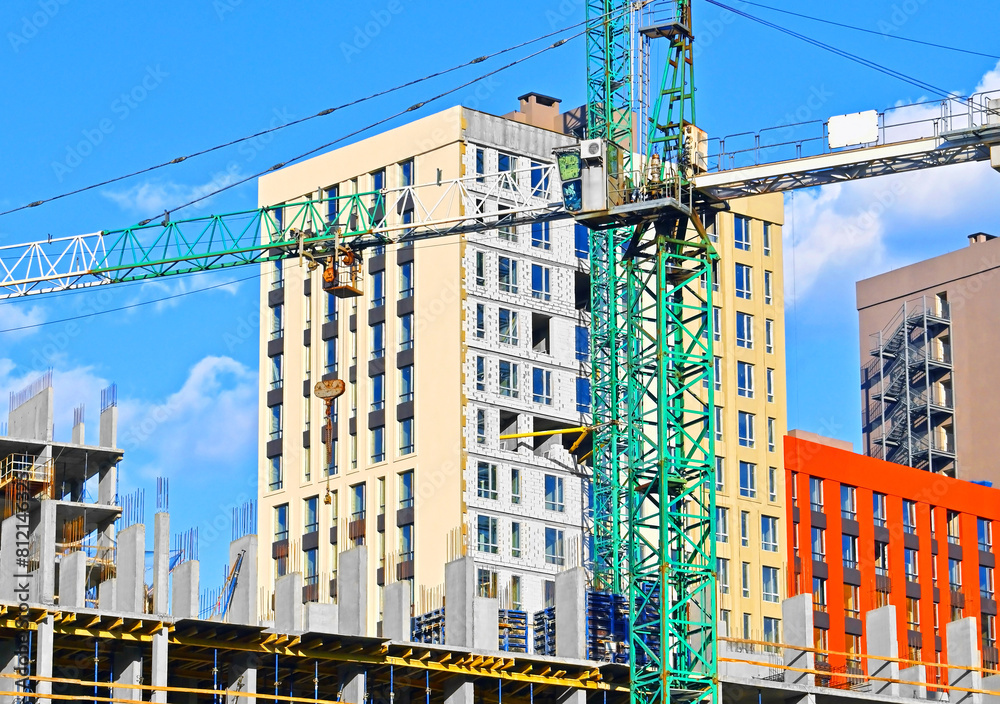 Naklejka premium Building crane and construction