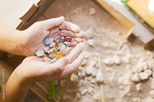 The child extracts stones