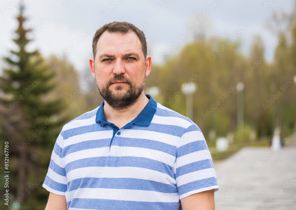 Portrait of a young man in a blue shirt Portrait of a young man in a blue shirt