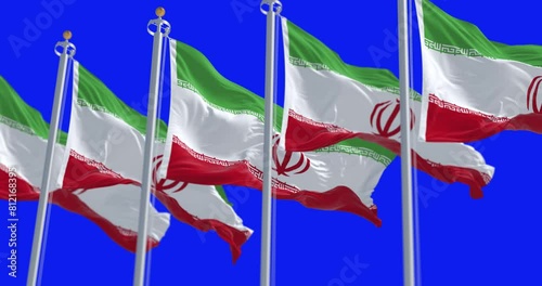 Islamic Republic of Iran national flags waving isolated on blue background photo