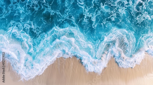 Aerial perspective of ocean waves on a sunlit beach  highlighting the rhythmic beauty of blue waters as a natural vacation background