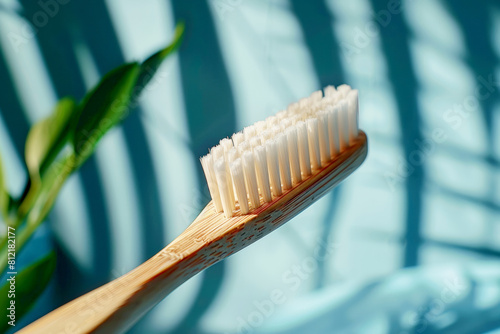 Eco-friendly realm with a close-up of a bamboo toothbrush on pastel blue background